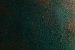 Textured surface with deep green and bronze tones creating an abstract background photo