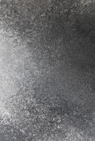 Surface texture showing a blend of gray tones with subtle variations and patterns for design use photo