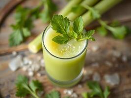 Refreshing Celery Juice in a Glass with Celery Stalks,top view photo