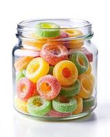 A jar filled with colorful gummy rings photo