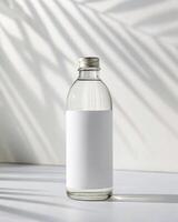 A white bottle with a white label on it photo