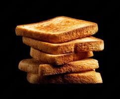 Golden toasted bread stacked high for delicious breakfasts and snacks photo