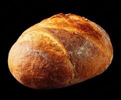 Freshly baked artisan bread loaf on a dark surface photo