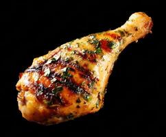 Grilled chicken drumstick with herbs and spices for flavorful meals photo