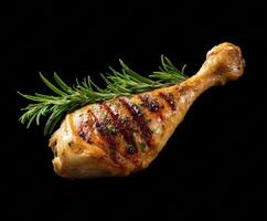 Grilled chicken leg with rosemary garnish for culinary delights photo