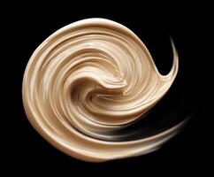 Creamy foundation swirl with smooth texture for makeup application photo