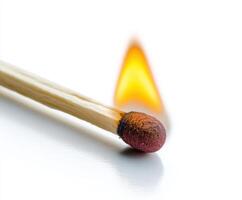 Match igniting with vibrant flame in close up detail photo