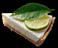 Refreshing lime dessert slice with cream and green leaf garnish photo