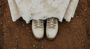A close up of the bride's shoes on the ground photo