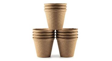 A stack of four brown paper cups photo