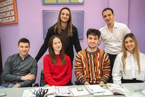 Group of happy students at language school class photo
