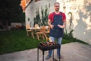Enjoying a barbecue in a cozy backyard gathering during summer twilight photo