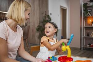 Mother and daughter enjoying a creative play session photo