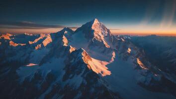 Snowy Mountain Peak at Sunrise photo