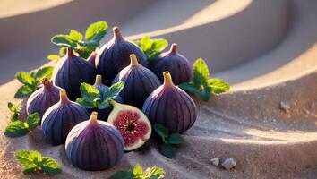 Fresh Figs with Mint Leaves on Sandy Surface photo
