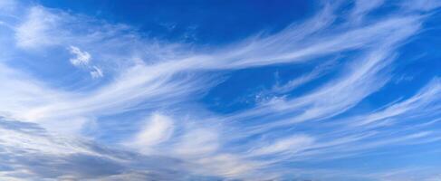 The Beautiful Sky with Wispy Clouds Under a Blue Horizon photo