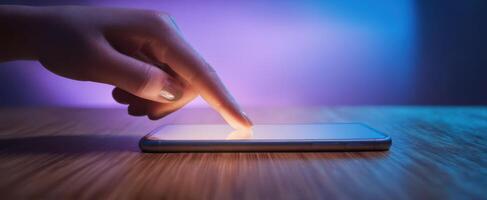 The Hand Interacting with a Smartphone Screen in Ambient Light photo