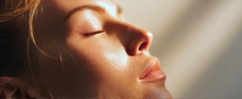 The tranquil beauty of a woman's serene profile illuminated by sunlight. photo