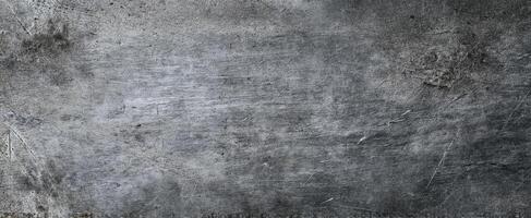 The textured gray metal surface with a weathered and industrial appearance. photo