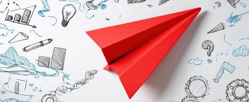 The red paper airplane atop a creative doodle background in an imaginative workspace. photo
