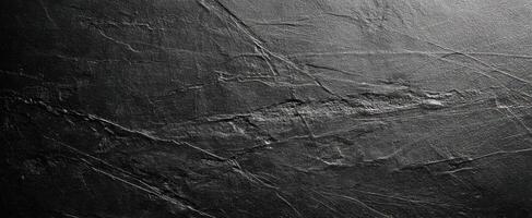 The textured dark surface with intricate patterns and natural elegance. photo
