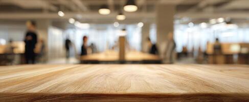 The wooden table in a modern office space with people collaborating. photo