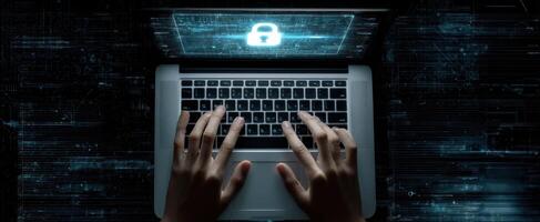 The laptop displaying a security lock symbol with hands typing in the foreground. photo