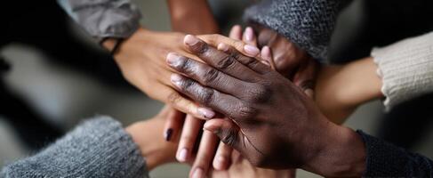 The hands of unity coming together in a powerful display of support. photo