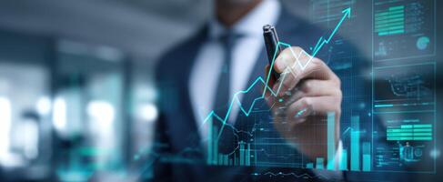 The businessman analyzing financial data and trends with digital graphs. photo