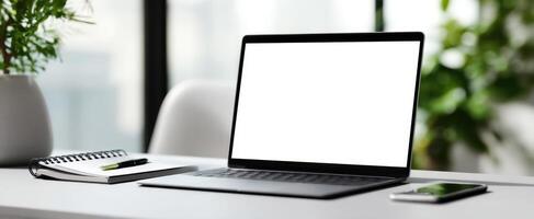 The sleek laptop on a modern desk in a bright workspace with minimal distractions. photo