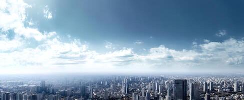 The expansive city skyline revealing a modern metropolis under a clear blue sky. photo