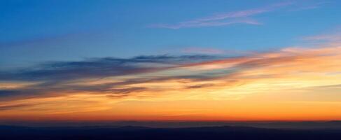 The breathtaking sunset painting the horizon with vibrant colors and tranquility. photo