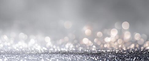 The shimmering silver surface filled with beautiful bokeh and sparkles. photo