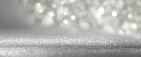 The shimmering silver glitter background with soft bokeh lights and elegance. photo