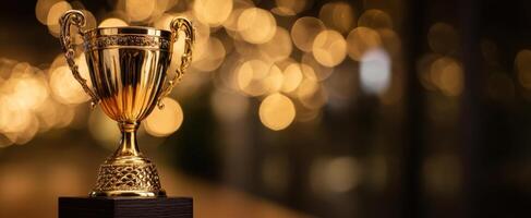 The shining trophy on display against a blurred festive background photo