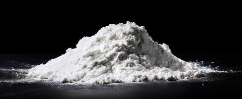 The mound of white flour ready for culinary creations and baking mastery. photo