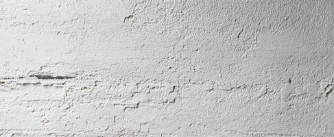 The textured white wall with rough surface details and minimalistic design photo