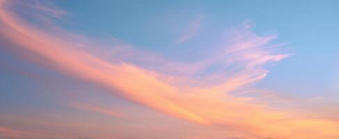 The Beautiful Sky with Soft Pink and Blue Clouds at Sunset photo