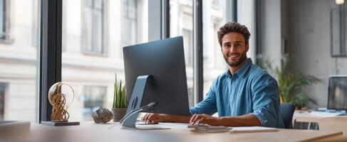 The smiling man working at a modern desk in a stylish office environment. photo