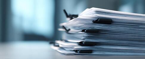 The stack of organized documents in a modern office environment. photo