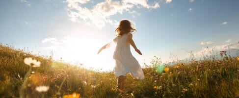 The girl joyfully running through a sunlit meadow filled with wildflowers. photo