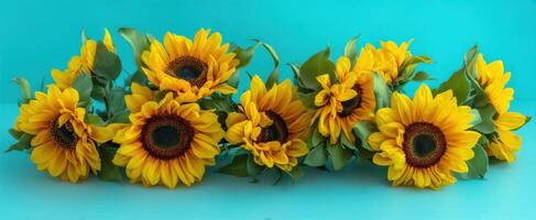The Bright and Cheerful Arrangement of Sunflowers Against a Turquoise Background. photo