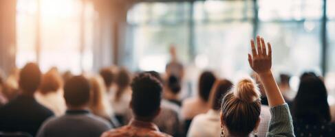 The engaged audience asking questions during a conference presentation photo