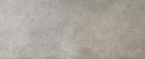 The textured concrete surface showcasing a minimalist and industrial aesthetic. photo