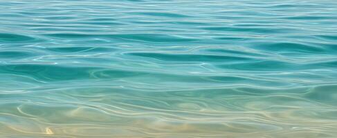 The tranquil blue water surface reflecting sunlight in a serene ocean setting. photo