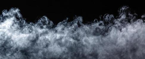 The swirling smoke creating an ethereal atmosphere against a dark background. photo