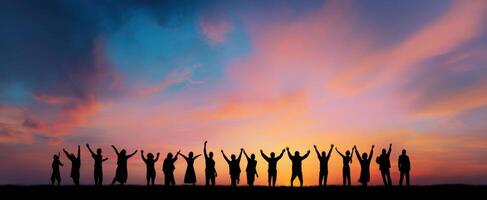 The celebration of unity under a vibrant sunset silhouette. photo