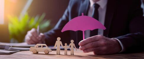 The insurance professional securing family protection with a pink umbrella. photo