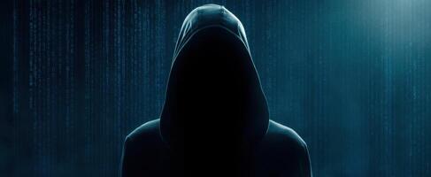 The mysterious hooded figure against a backdrop of swirling digital data photo