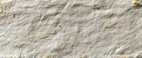 The textured background of handmade paper with natural fibers and unique patterns. photo